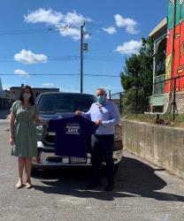 Image - Executive Director of YES Shelter Meagan Hennekam and Hydro One’s Chief Corporate Affairs and Customer Care Officer Jason Fitzsimmons in front of YES Shelter’s new truck.
